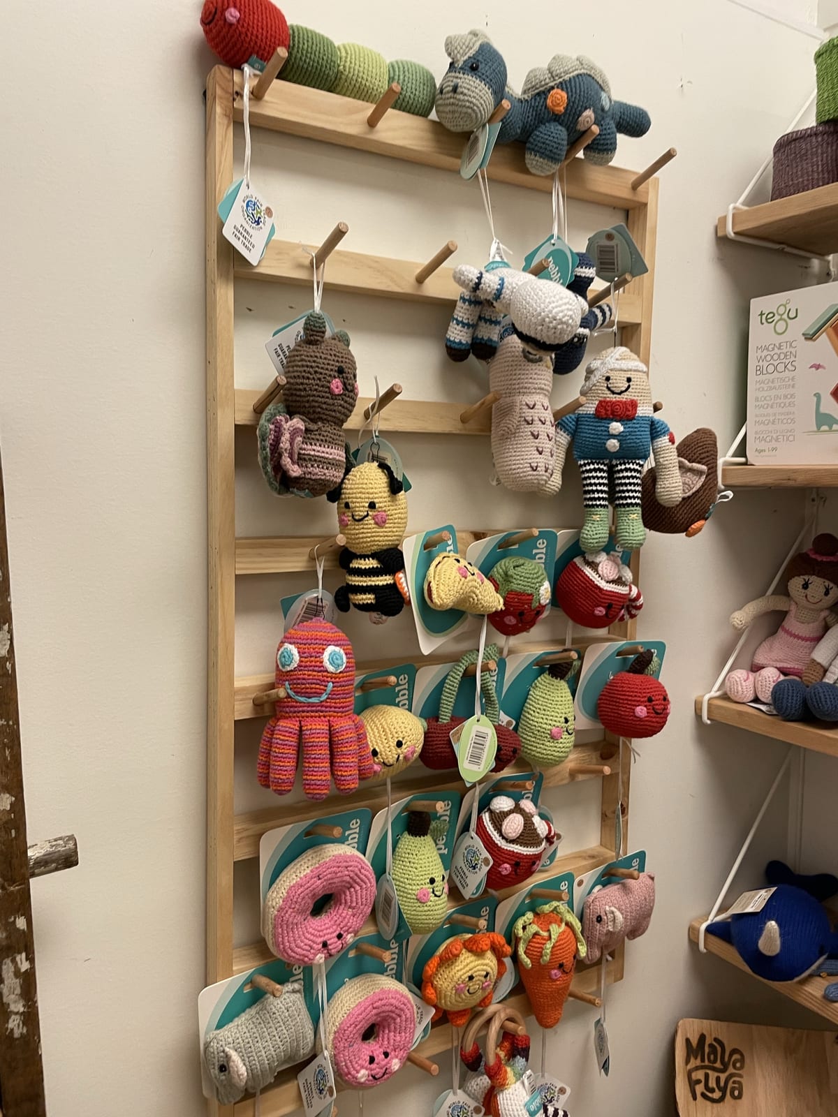 A wall of knitted stuffed animals for sale in a downtown Kennett Square shop