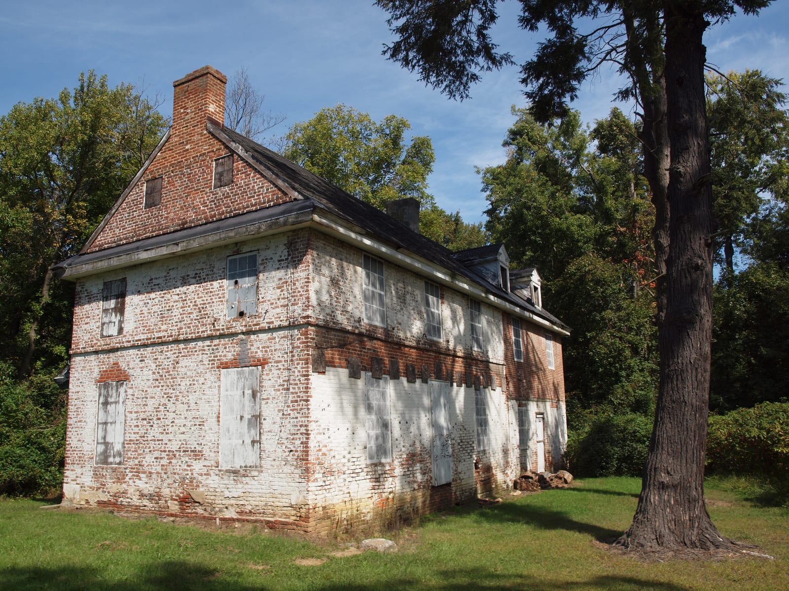 The historic Lum's Mill House at Lums Pond State Park, a stone-and-clapboard structure listed on the National Register of Historic Places