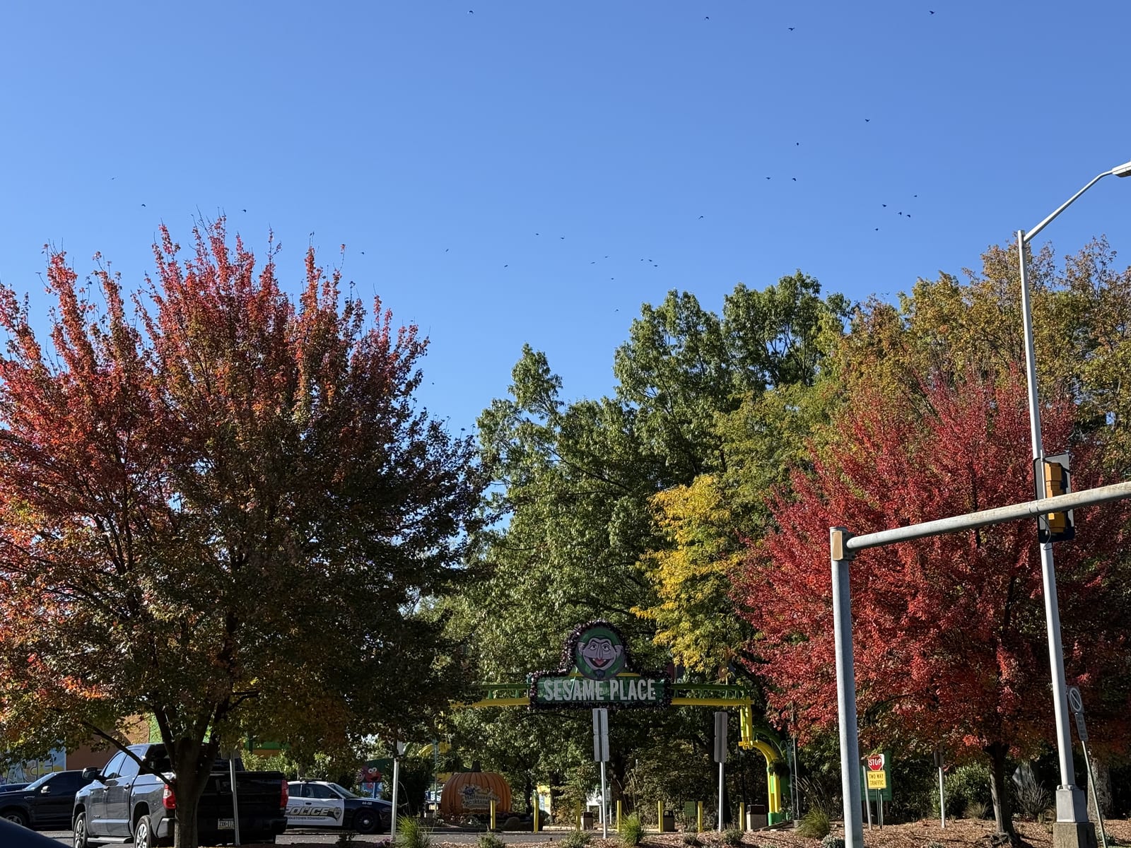 The main entrance to Sesame Place theme park near Philadelphia, framed by autumn foliage