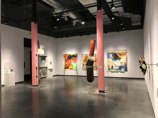 Installation view of contemporary art exhibition featuring painting and sculpture
